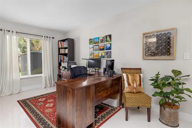 a workspace with furniture and a potted plant
