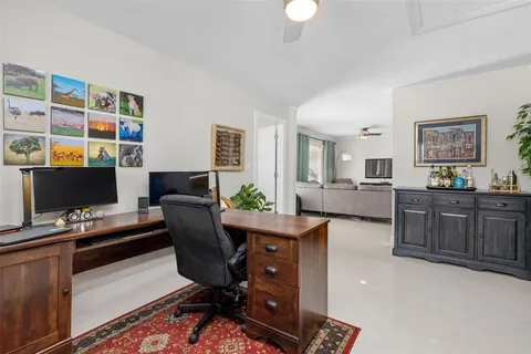 a view of a workspace with furniture and cabinet