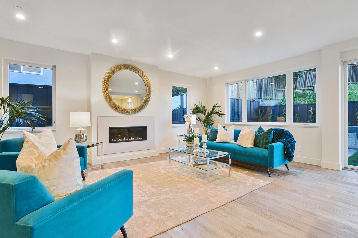 300 Helen Drive Millbrae, CA 94030 - Photo 2 of 16 a living room with furniture a fireplace and a large window