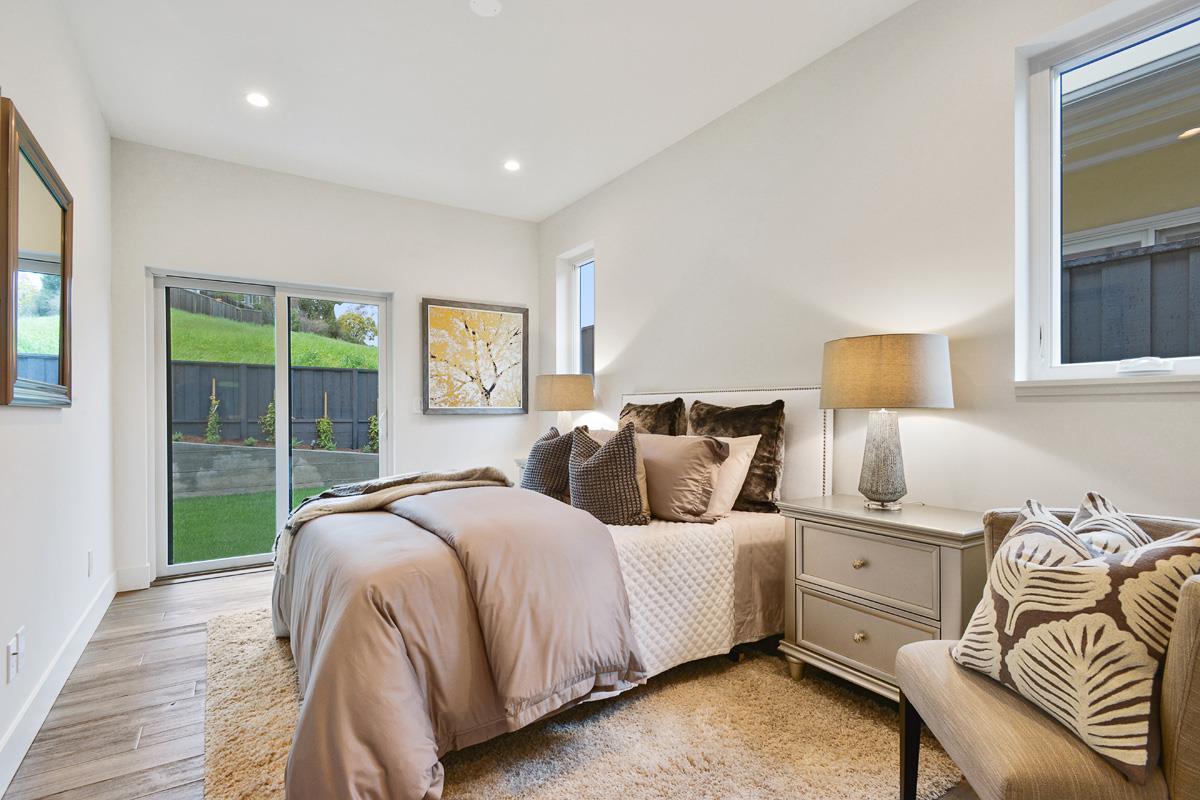 300 Helen Drive Millbrae, CA 94030 - Photo 10 of 16 a bedroom with a bed and wooden floor