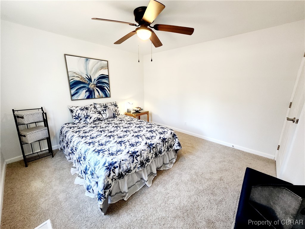 10766 Figg Shop Road Gloucester, VA 23061 - Photo 17 of 24 BR #2 Carpeted bedroom featuring a ceiling fan