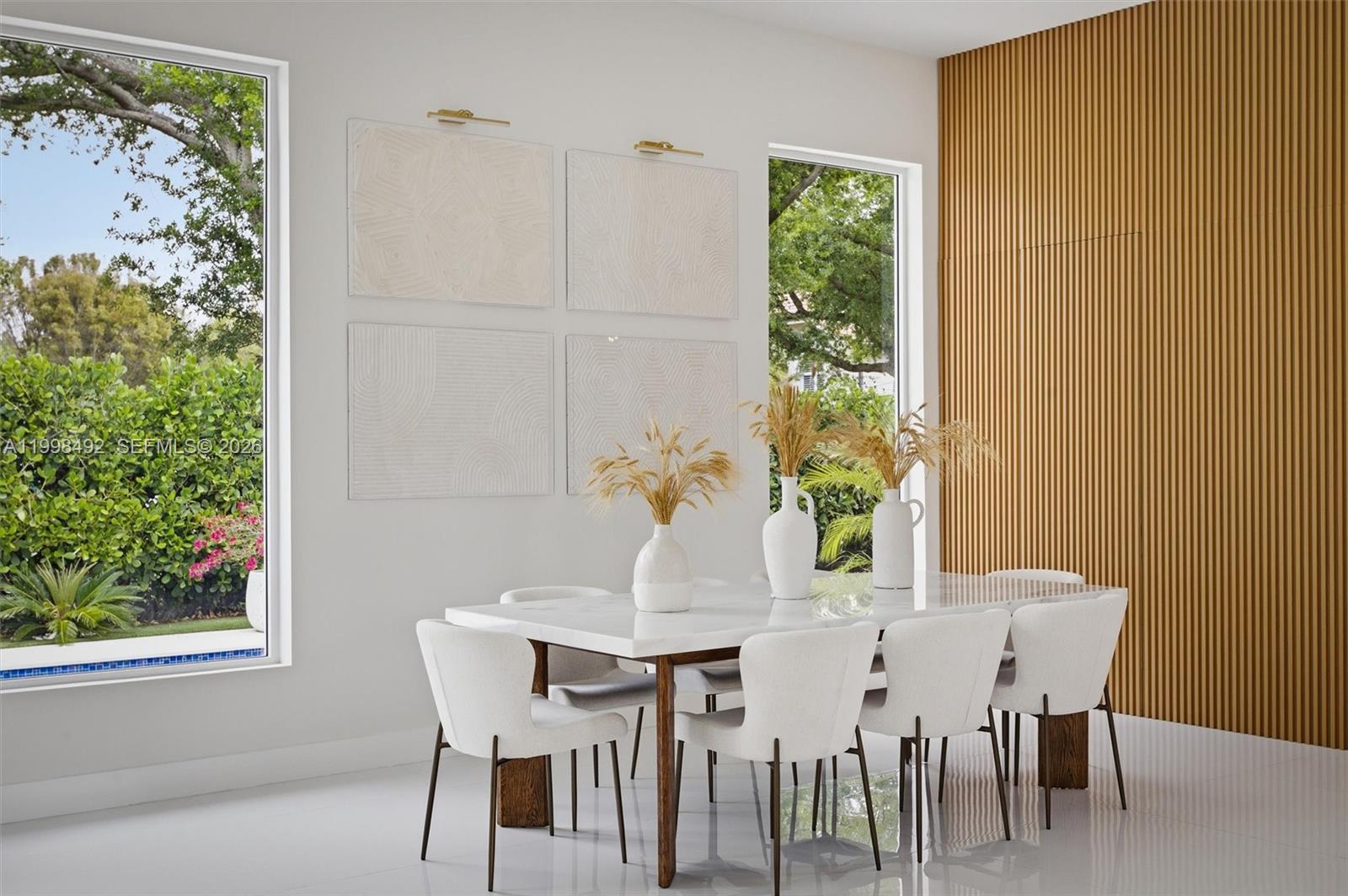 9717 Southwest 94th Terrace Miami, FL 33176 - Photo 12 of 63 a view of a dining room with furniture and a potted plant