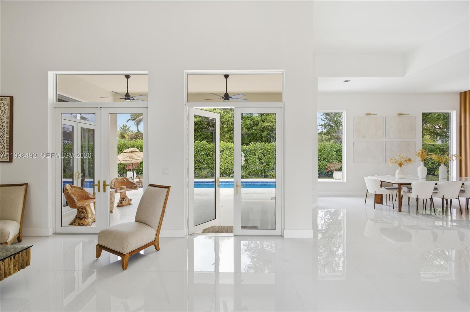 9717 Southwest 94th Terrace Miami, FL 33176 - Photo 16 of 63 a living room with furniture and large windows
