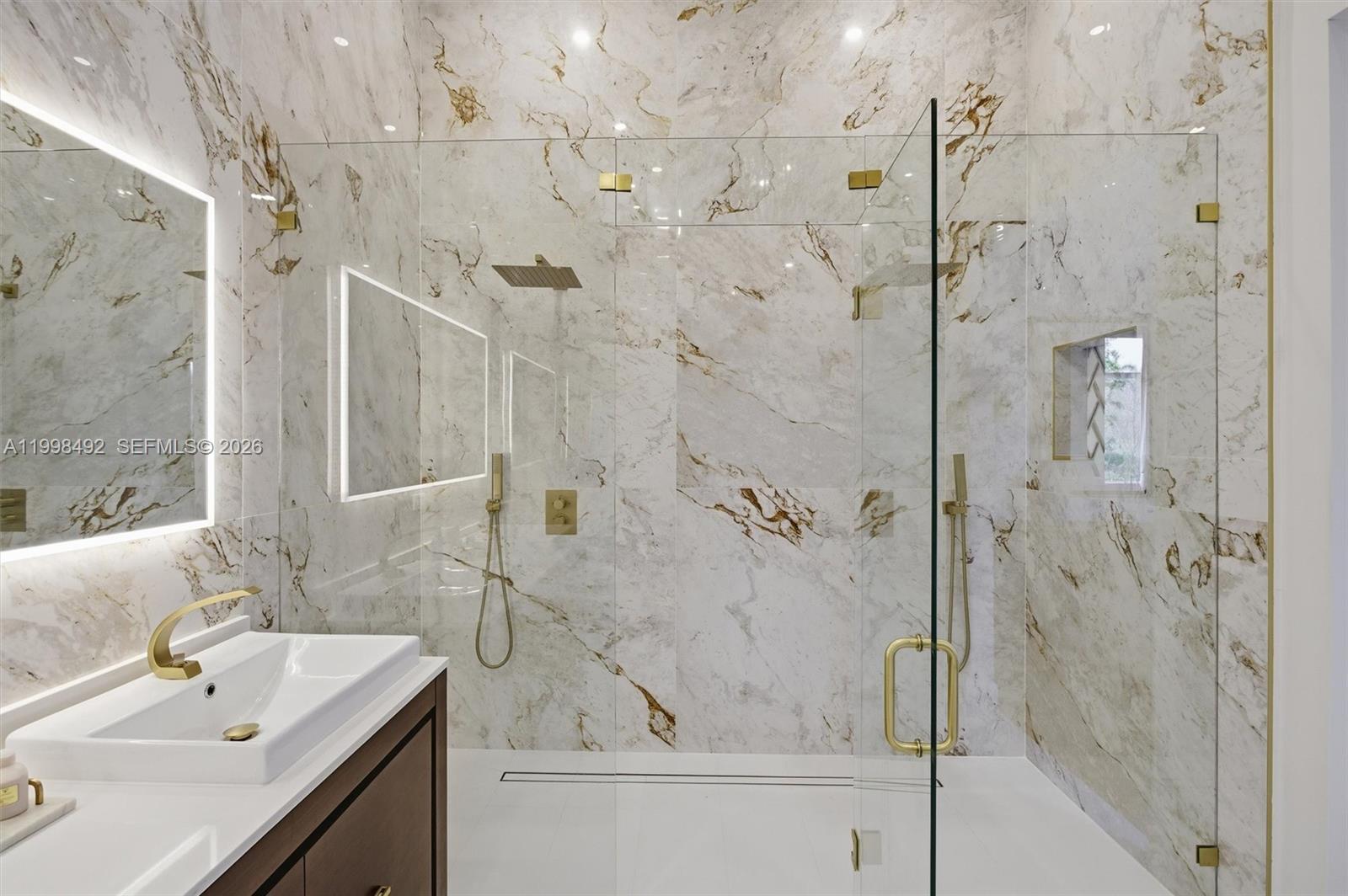 9717 Southwest 94th Terrace Miami, FL 33176 - Photo 27 of 63 a bathroom with a sink shower and a mirror