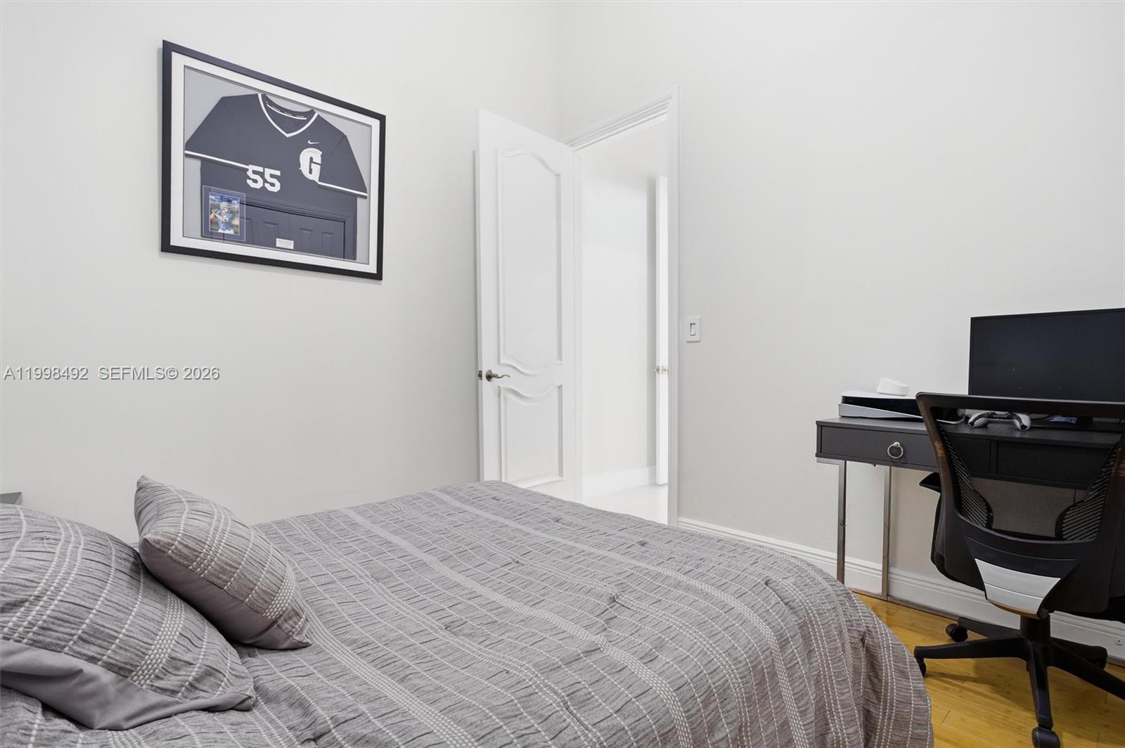 9717 Southwest 94th Terrace Miami, FL 33176 - Photo 35 of 63 a bedroom with a bed and a tv