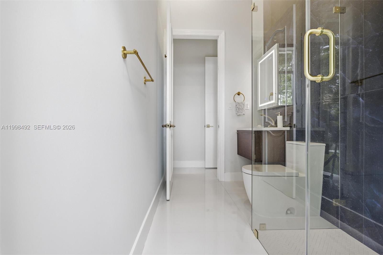 9717 Southwest 94th Terrace Miami, FL 33176 - Photo 37 of 63 a walk in closet and bathroom