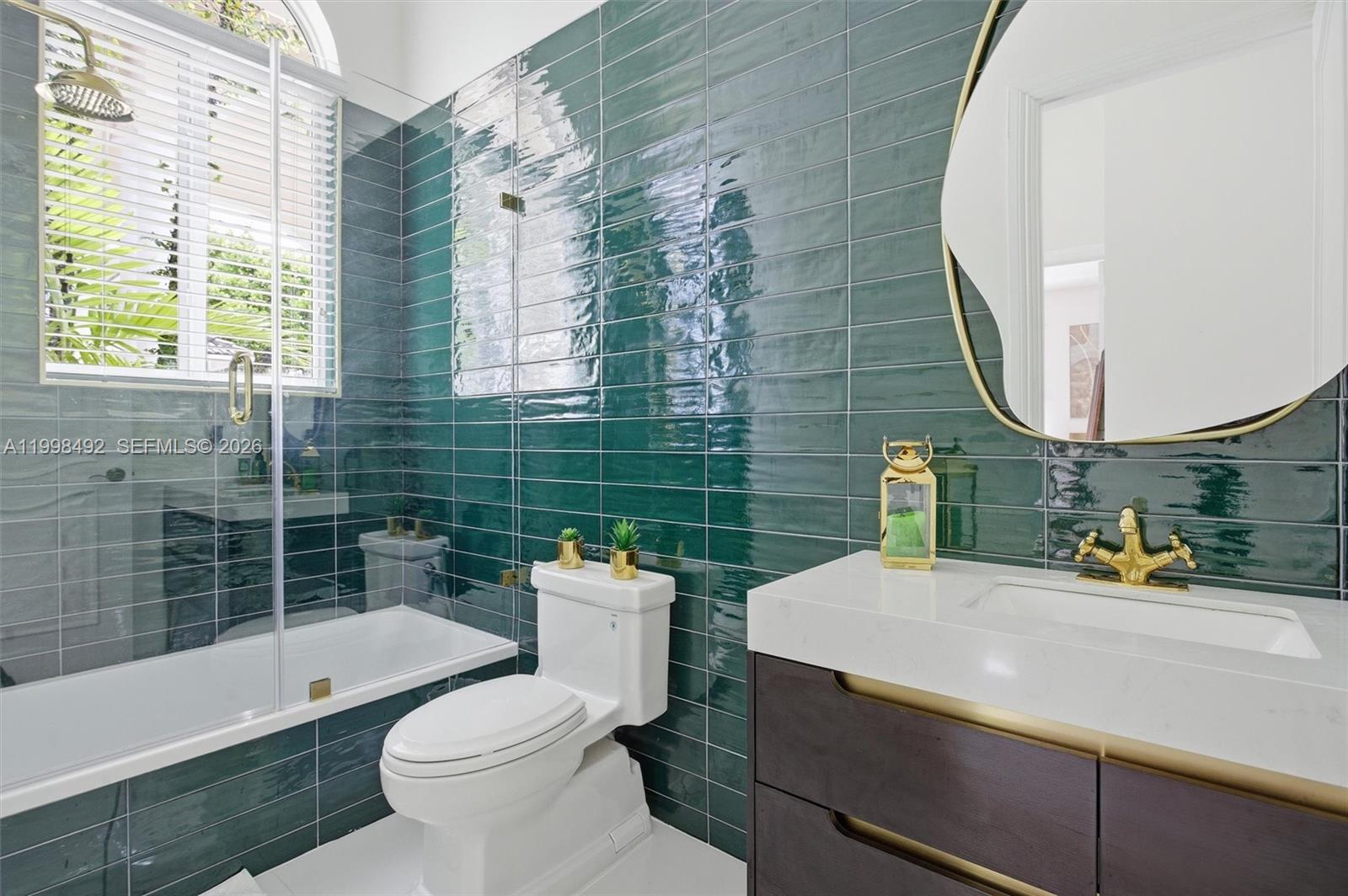 9717 Southwest 94th Terrace Miami, FL 33176 - Photo 40 of 63 a bathroom with a sink a toilet and a bathtub