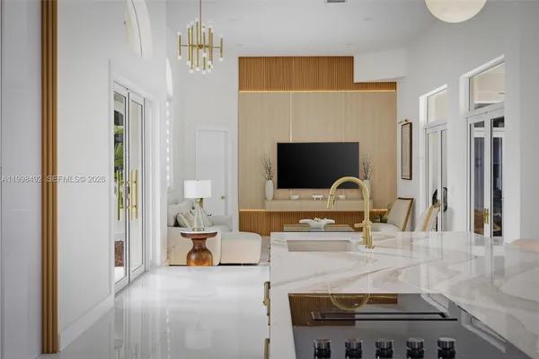 a kitchen with stainless steel appliances a stove a refrigerator a sink and a microwave