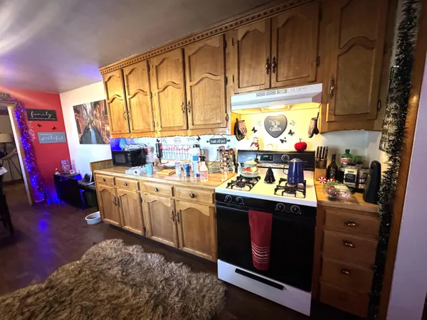 a bedroom with a bed and dresser