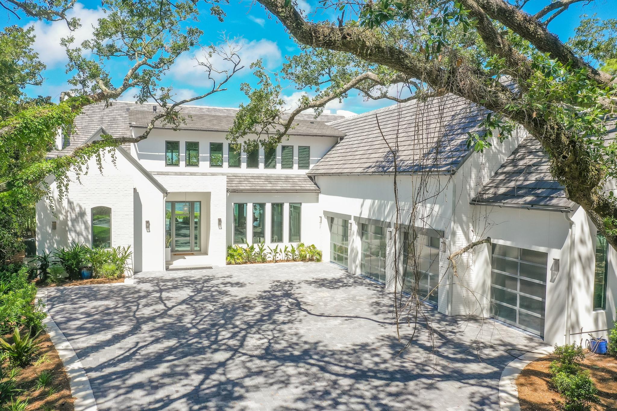337 Driftwood Point Road Santa Rosa Beach, FL 32459 - Photo 25 of 82 a front view of a house with a yard and table and chairs