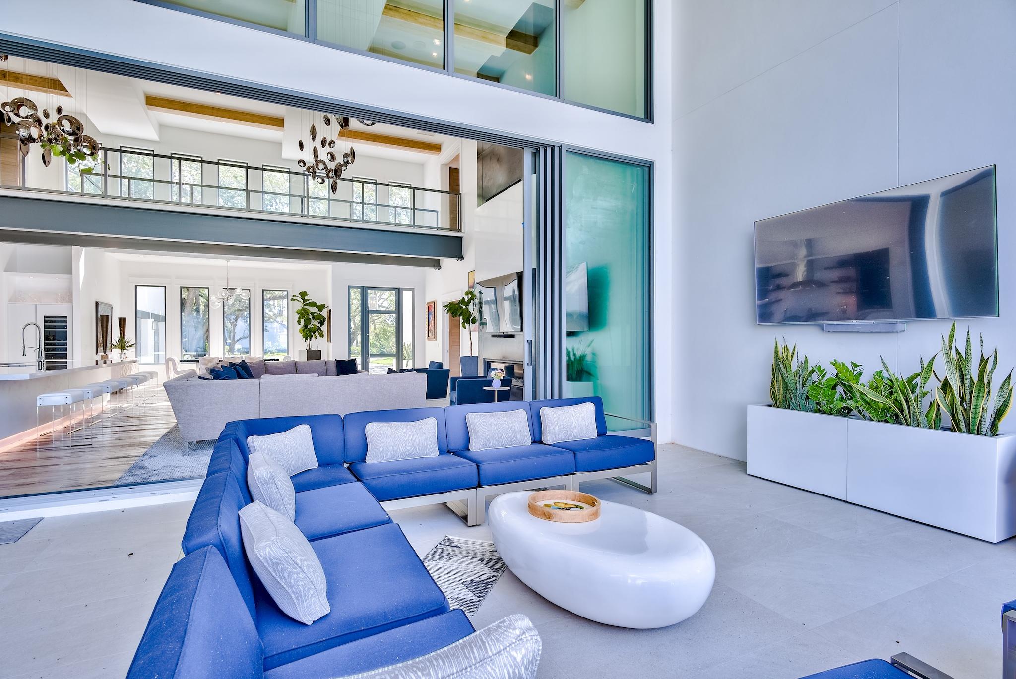 337 Driftwood Point Road Santa Rosa Beach, FL 32459 - Photo 32 of 82 a living room with furniture and a floor to ceiling window