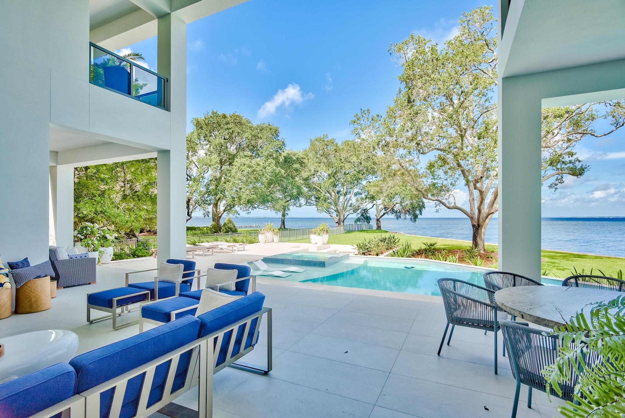 337 Driftwood Point Road Santa Rosa Beach, FL 32459 - Photo 38 of 82 a view of a patio with swimming pool and outdoor seating