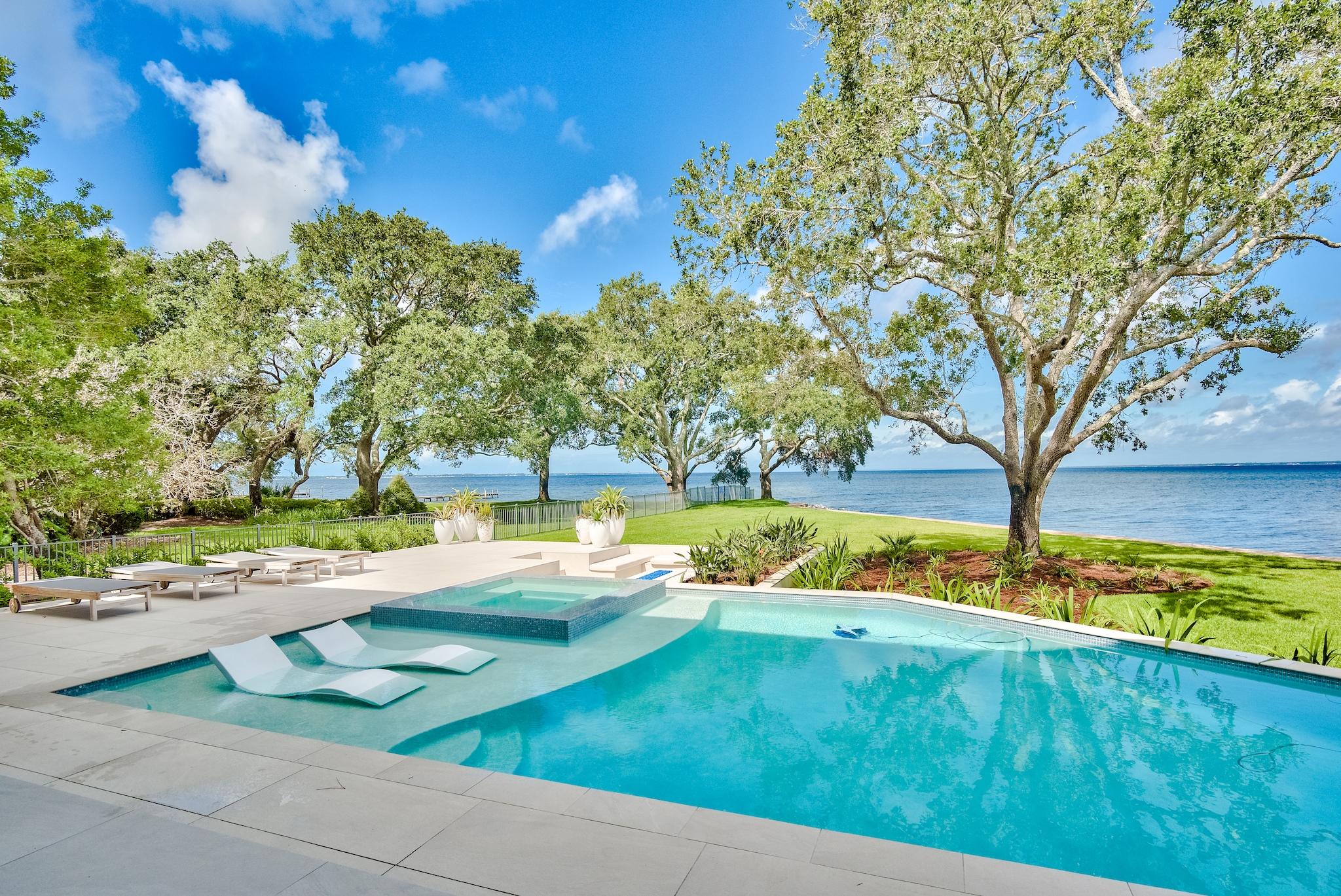 337 Driftwood Point Road Santa Rosa Beach, FL 32459 - Photo 39 of 82 a view of a swimming pool with an outdoor space and seating area