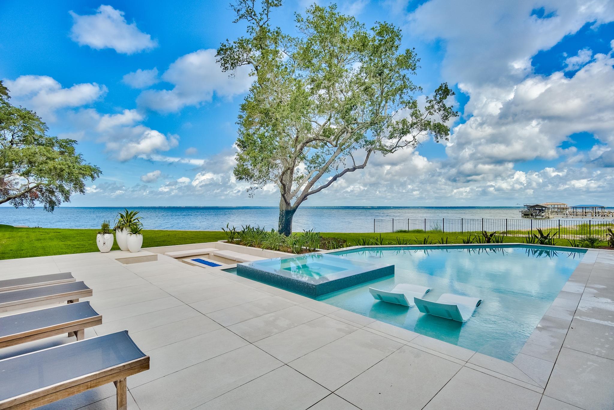 337 Driftwood Point Road Santa Rosa Beach, FL 32459 - Photo 40 of 82 a view of a swimming pool with an outdoor seating
