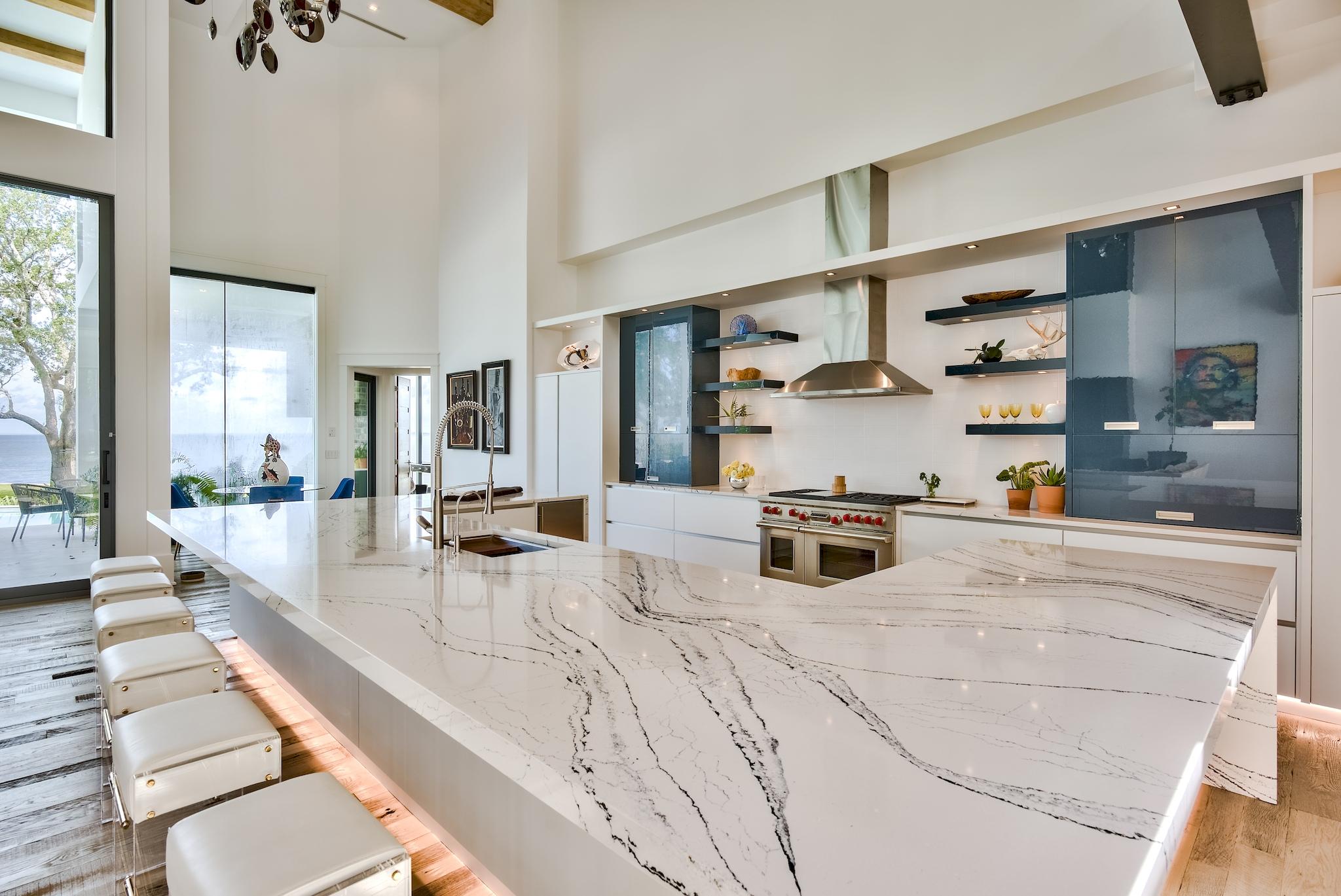 337 Driftwood Point Road Santa Rosa Beach, FL 32459 - Photo 50 of 82 a kitchen with stainless steel appliances kitchen island granite countertop a sink and cabinets