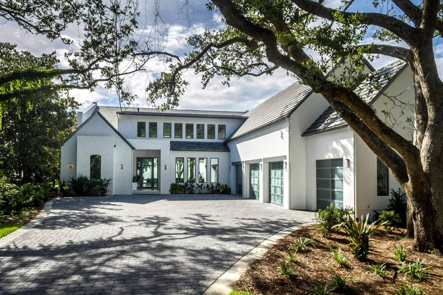 337 Driftwood Point Road Santa Rosa Beach, FL 32459 - Photo 5 of 82 a front view of a house with a yard and potted plants