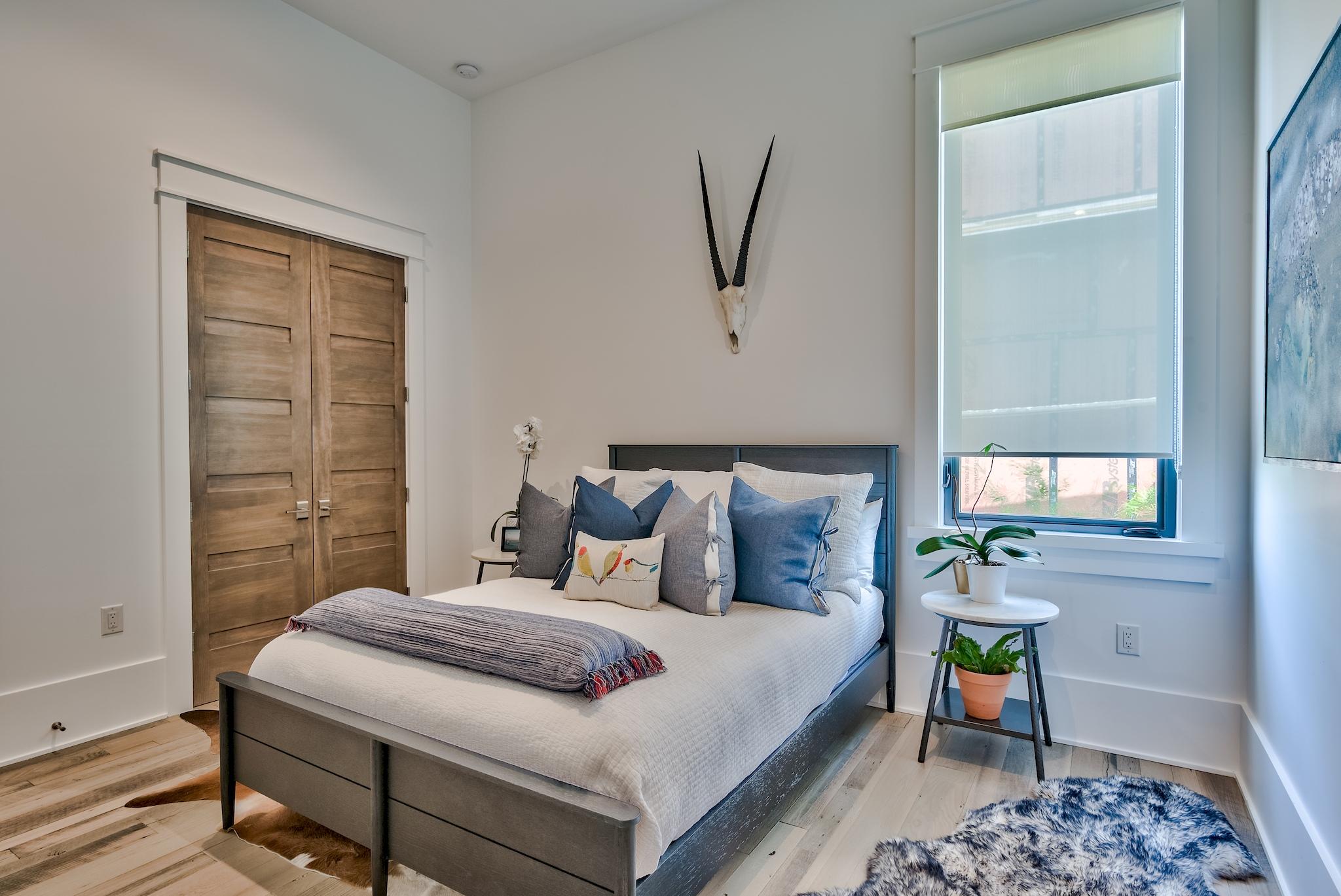 337 Driftwood Point Road Santa Rosa Beach, FL 32459 - Photo 69 of 82 a bedroom with a bed and a painting on the wall