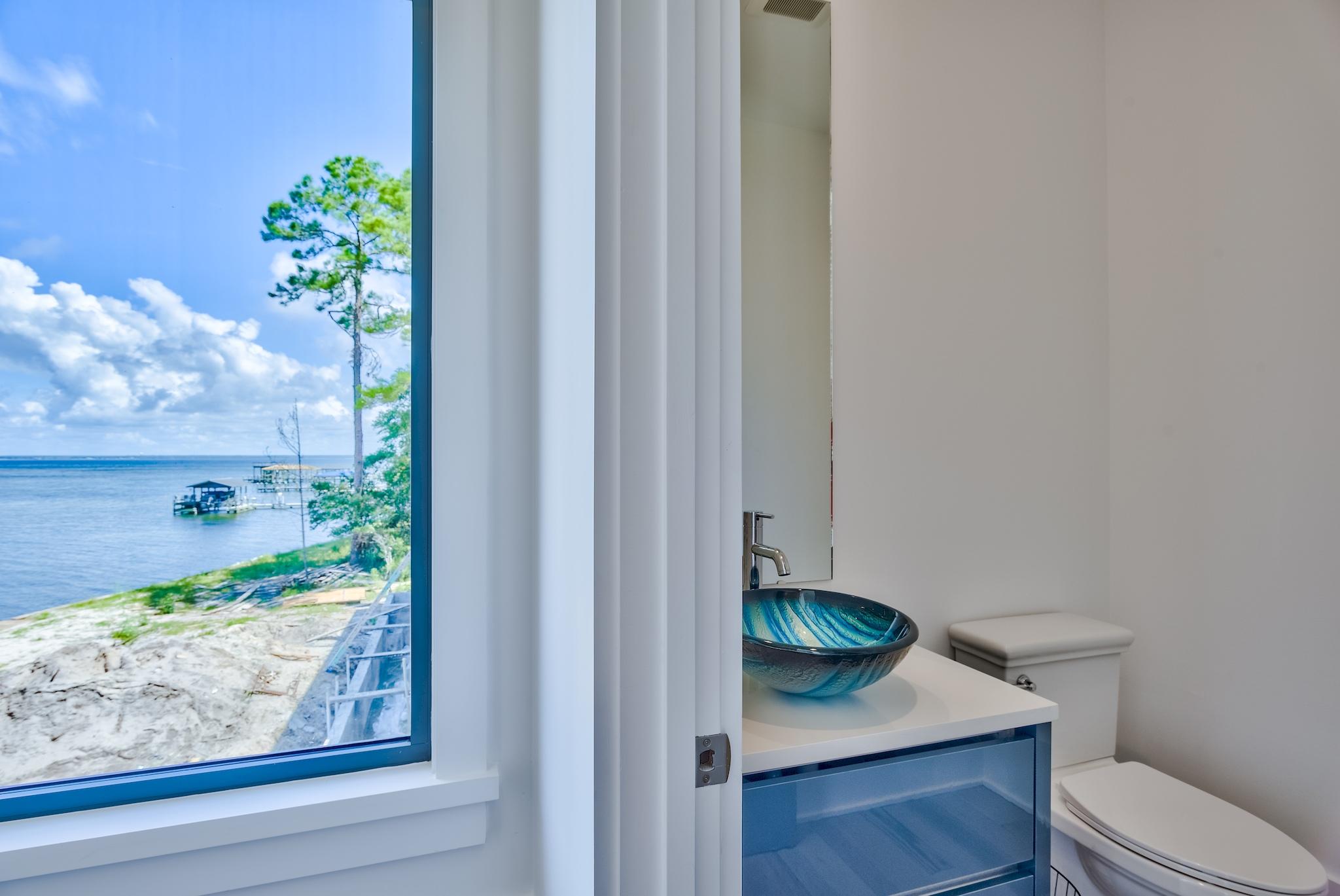 337 Driftwood Point Road Santa Rosa Beach, FL 32459 - Photo 73 of 82 a view of bathroom with a toilet sink and mirror
