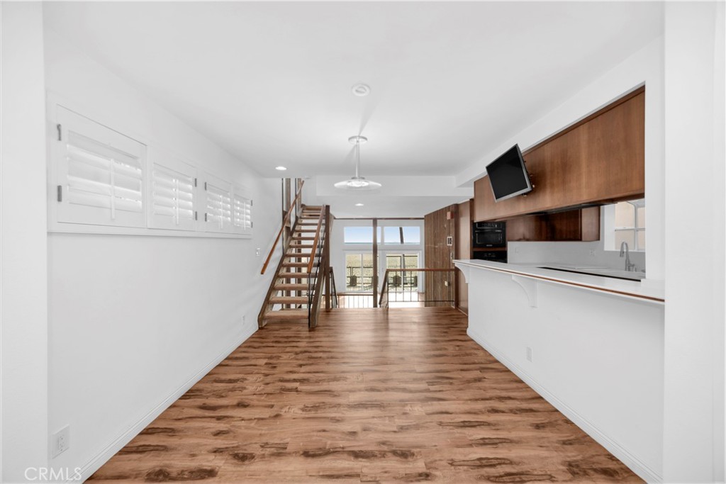 57 Surfside Avenue Surfside, CA 90743 - Photo 16 of 39 a view of an entryway with wooden floor