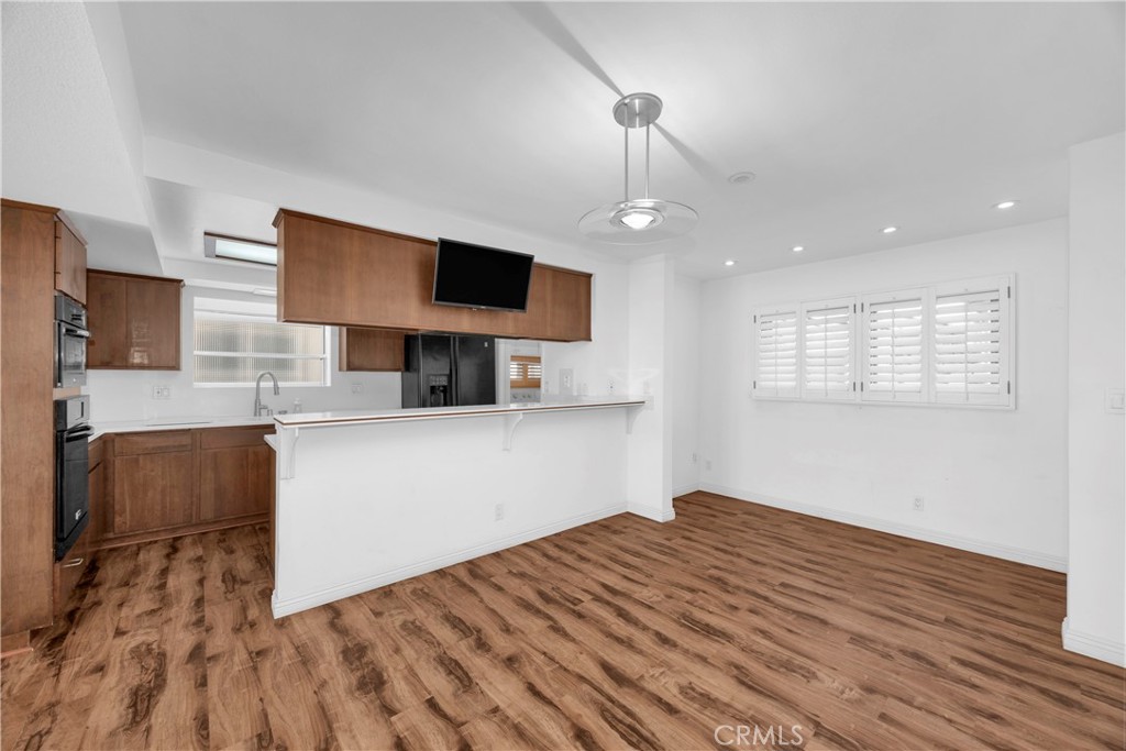 57 Surfside Avenue Surfside, CA 90743 - Photo 17 of 39 a bedroom with a bed and a flat screen tv