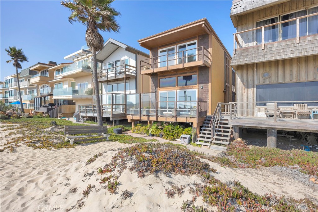 57 Surfside Avenue Surfside, CA 90743 - Photo 2 of 39 a view of house with outdoor space and swimming pool