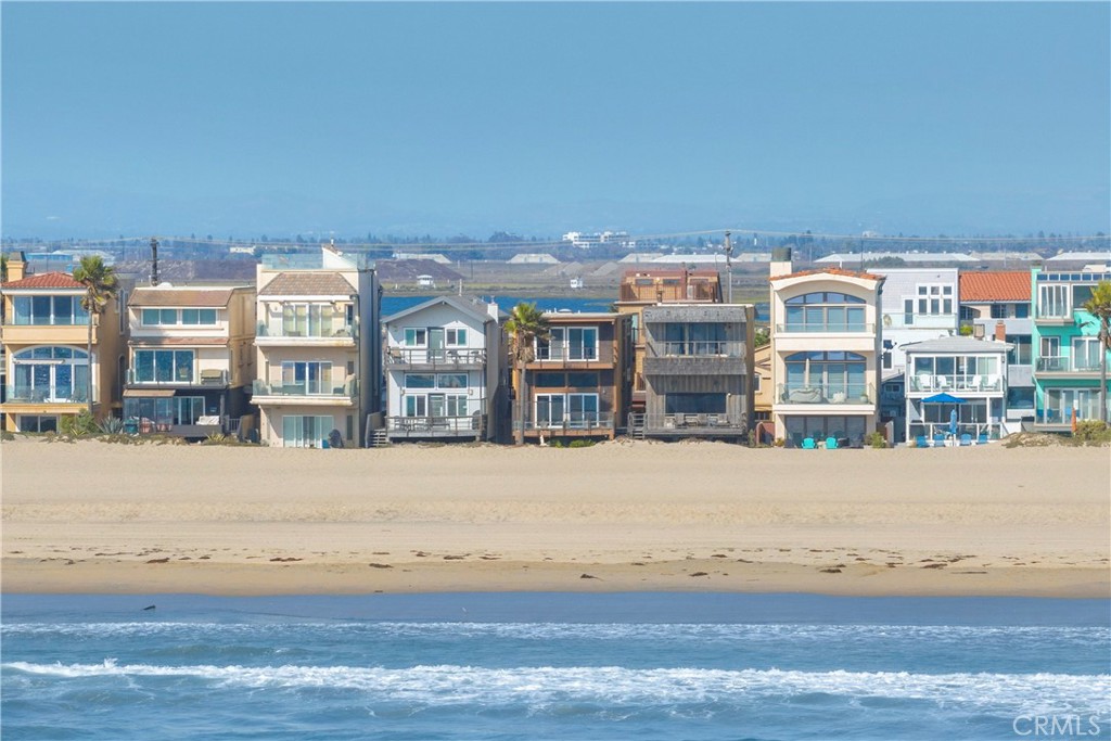 57 Surfside Avenue Surfside, CA 90743 - Photo 36 of 39 a front view of building with yard