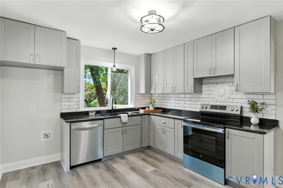 4825 Kinloch Lane Henrico, VA 23231 - Photo 2 of 28 a kitchen with a stove sink and cabinets