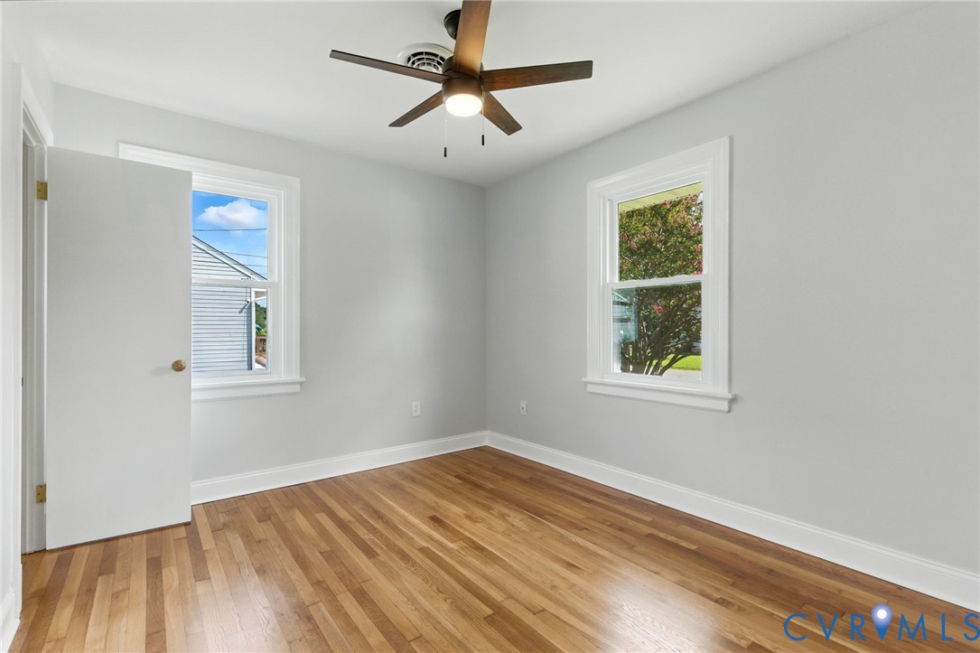 4825 Kinloch Lane Henrico, VA 23231 - Photo 21 of 28 a view of empty room with wooden floor and fan
