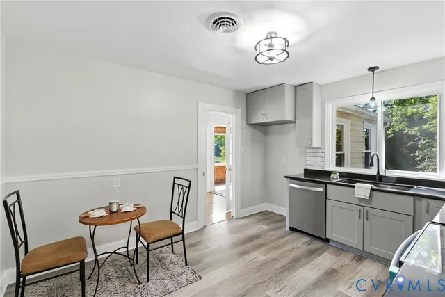 a view of a dining room with furniture window and wooden floor