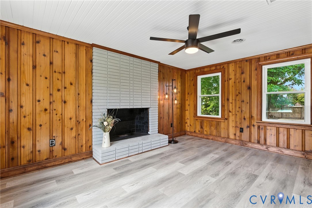 4825 Kinloch Lane Henrico, VA 23231 - Photo 9 of 28 a view of a livingroom with wooden floor a ceiling fan and window