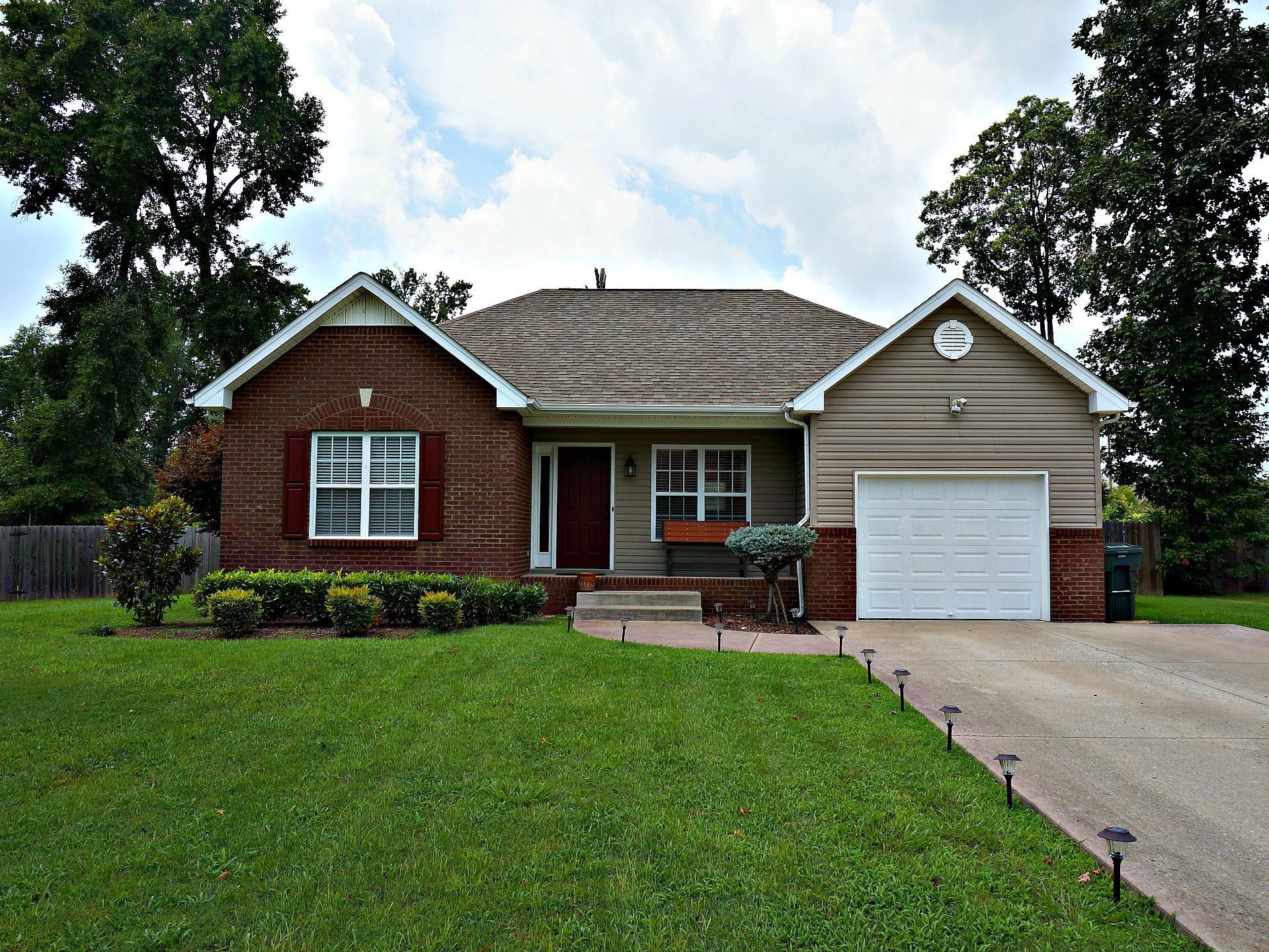 128 Filly Lane Springfield, TN 37172 - Photo 1 of 23 a front view of a house with a yard and garage
