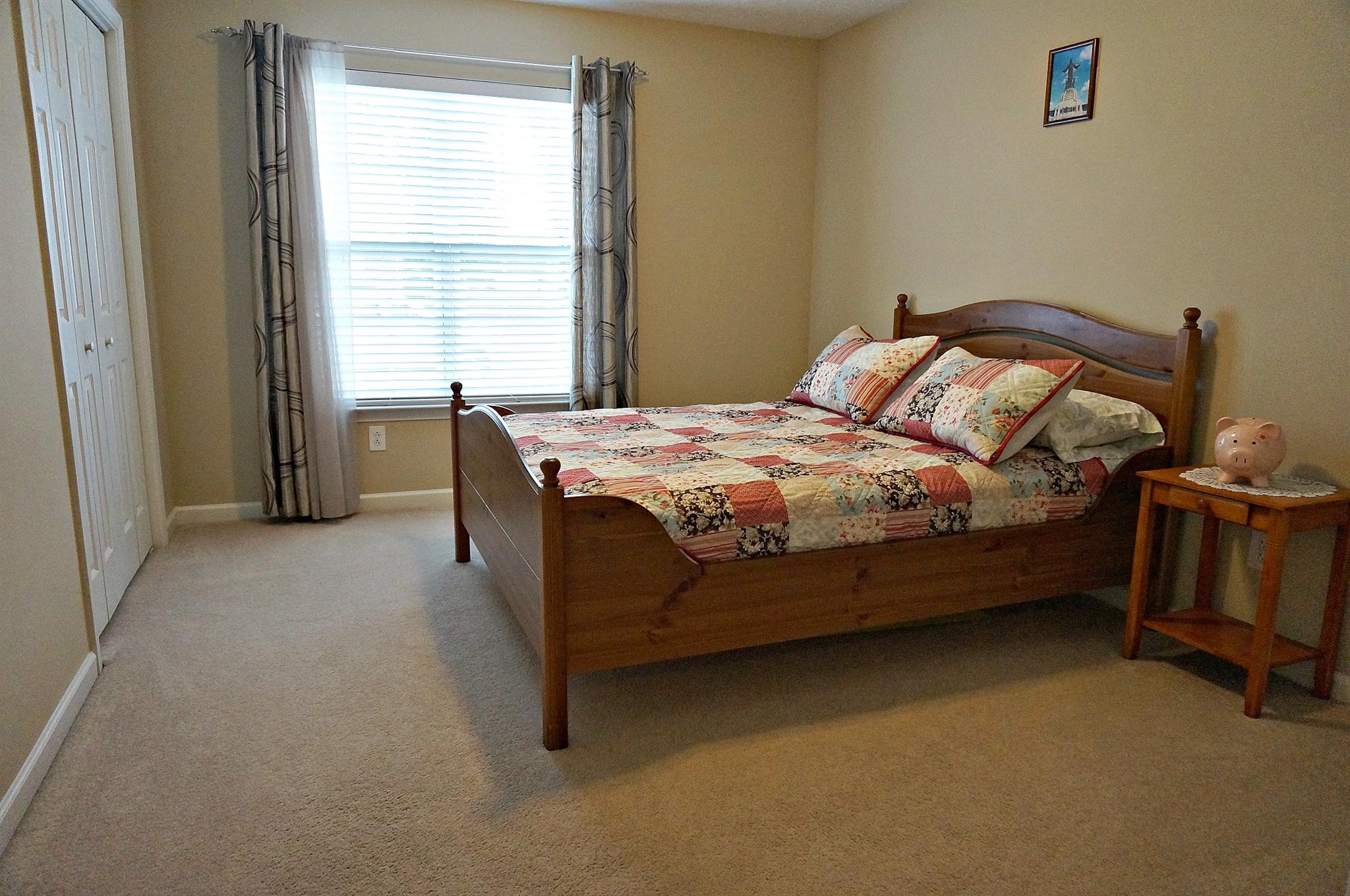 128 Filly Lane Springfield, TN 37172 - Photo 13 of 23 a bed sitting in a bedroom next to a window