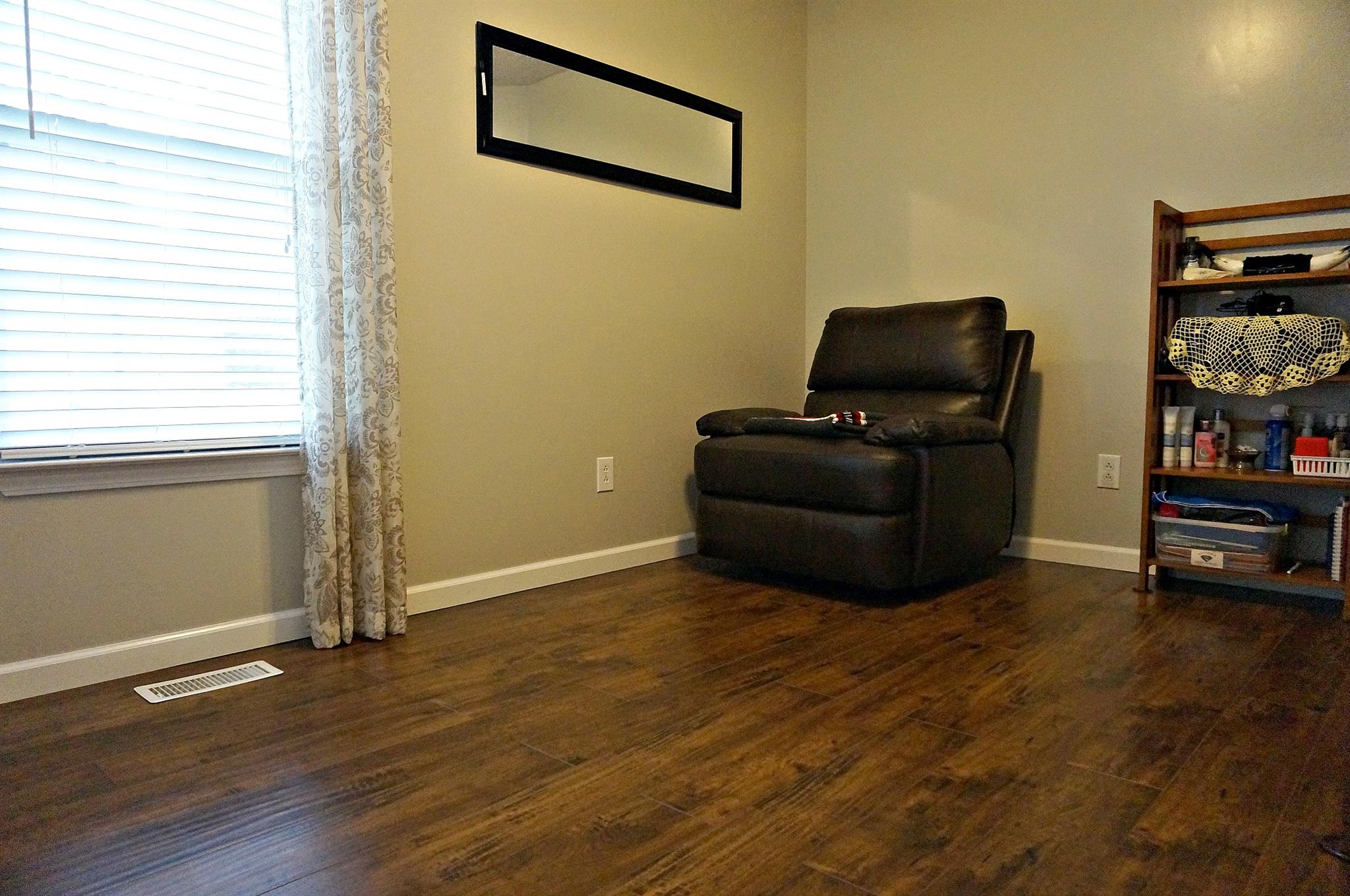 128 Filly Lane Springfield, TN 37172 - Photo 17 of 23 a living room with furniture and a flat screen tv