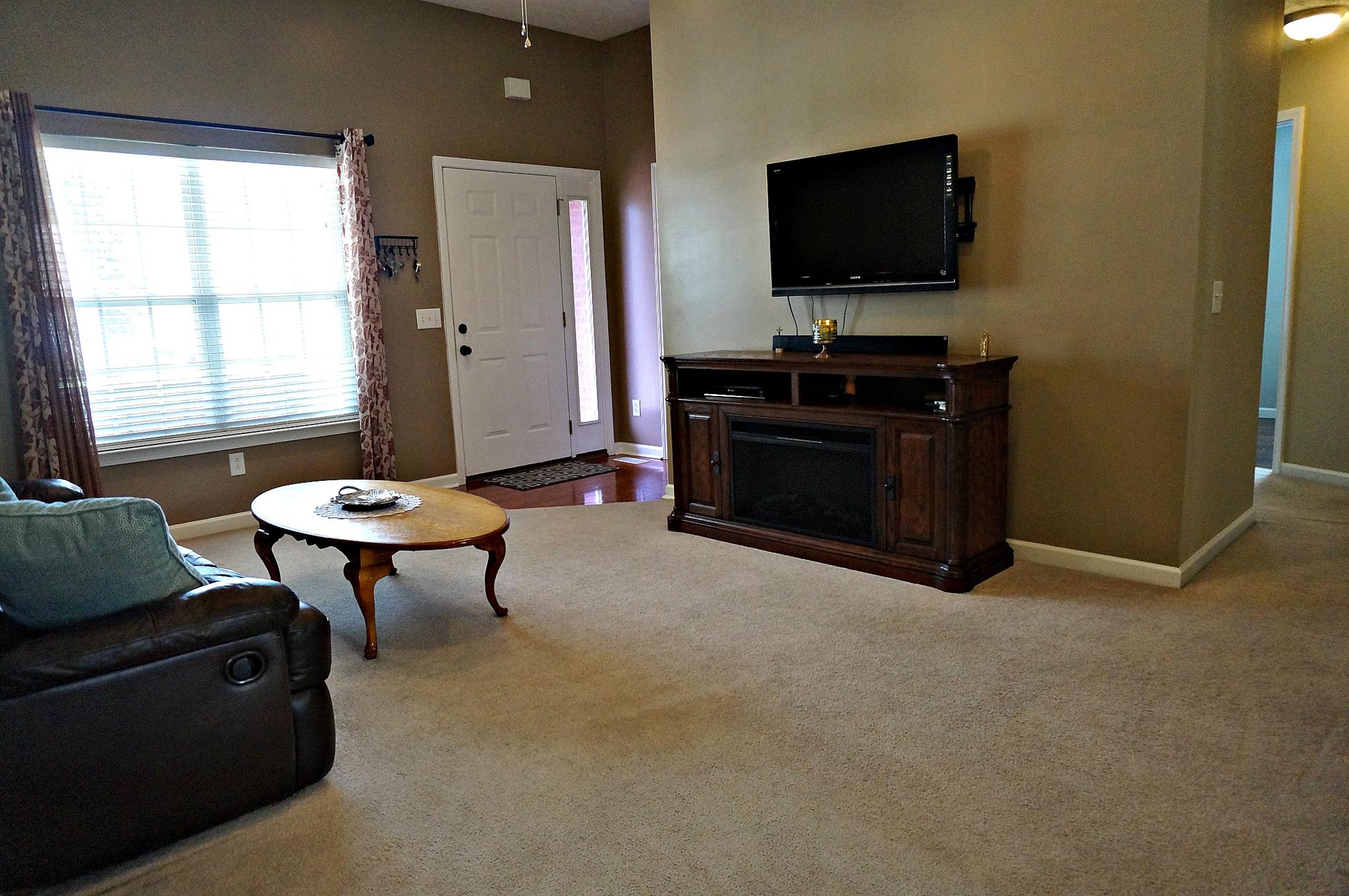 128 Filly Lane Springfield, TN 37172 - Photo 4 of 23 a living room with furniture and a flat screen tv