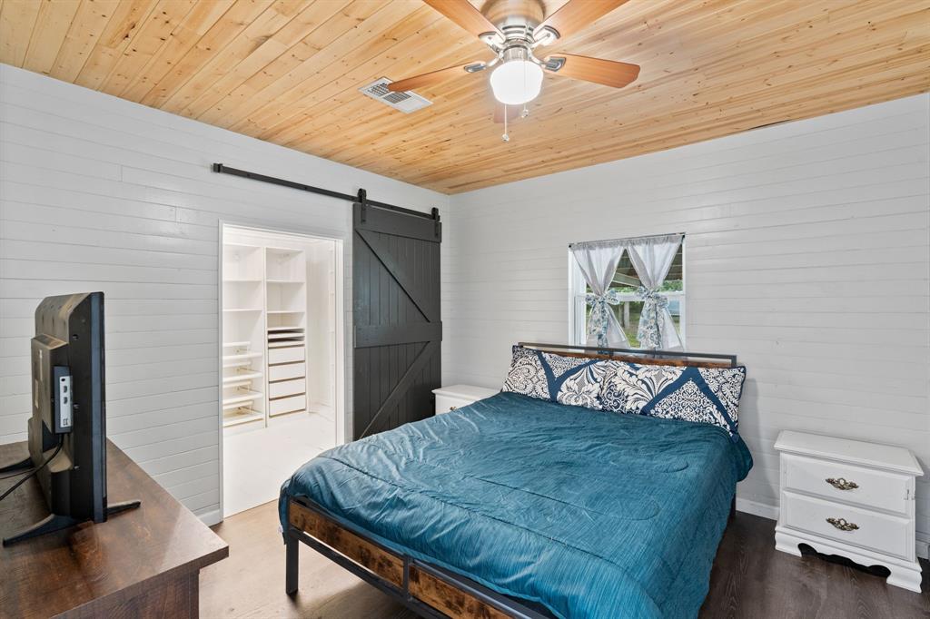 17790 County Road 345 Terrell, TX 75161 - Photo 23 of 37 a bedroom with a bed and a flat screen tv