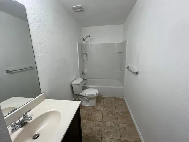 a bathroom with a sink and toilet