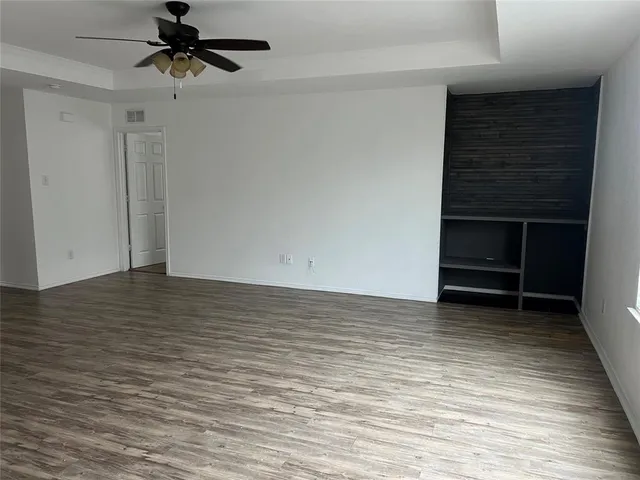 a view of an empty room with a bathroom