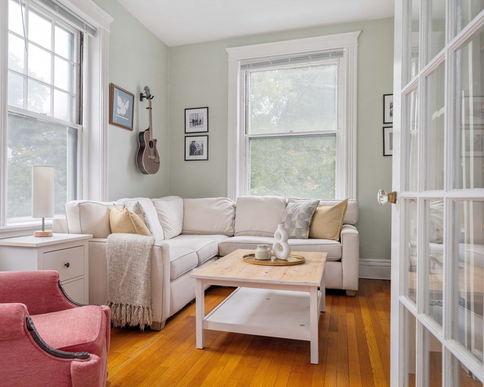 503 Boylston Street, Unit 4 Brookline, MA 02445 - Photo 11 of 16 a living room with furniture large window and wooden floor