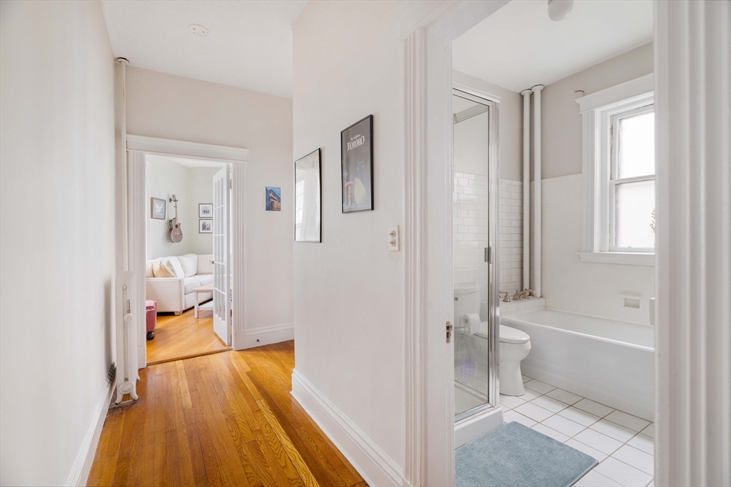 503 Boylston Street, Unit 4 Brookline, MA 02445 - Photo 13 of 16 a bathroom with a tub shower and toilet