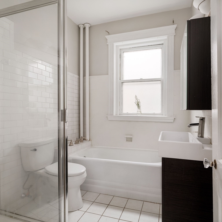 503 Boylston Street, Unit 4 Brookline, MA 02445 - Photo 14 of 16 a bathroom with a sink toilet and shower