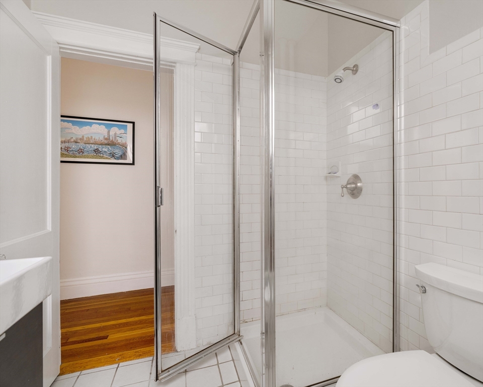 503 Boylston Street, Unit 4 Brookline, MA 02445 - Photo 15 of 16 a bathroom with a shower and a toilet
