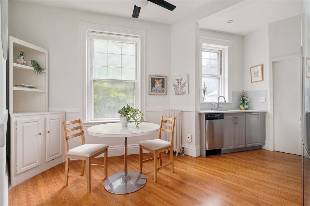 503 Boylston Street, Unit 4 Brookline, MA 02445 - Photo 3 of 16 a view of a dining room with furniture and wooden floor