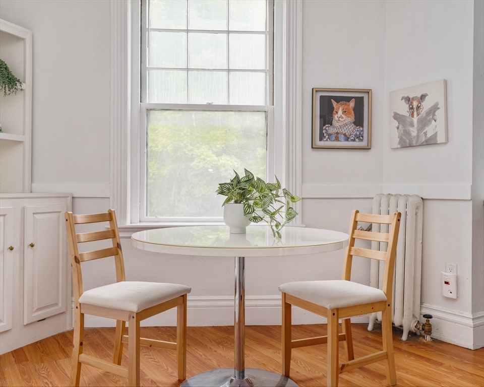 503 Boylston Street, Unit 4 Brookline, MA 02445 - Photo 4 of 16 a view of a dining room with furniture and wooden floor