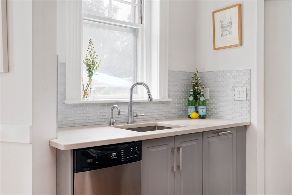 503 Boylston Street, Unit 4 Brookline, MA 02445 - Photo 6 of 16 a kitchen with a sink and a window