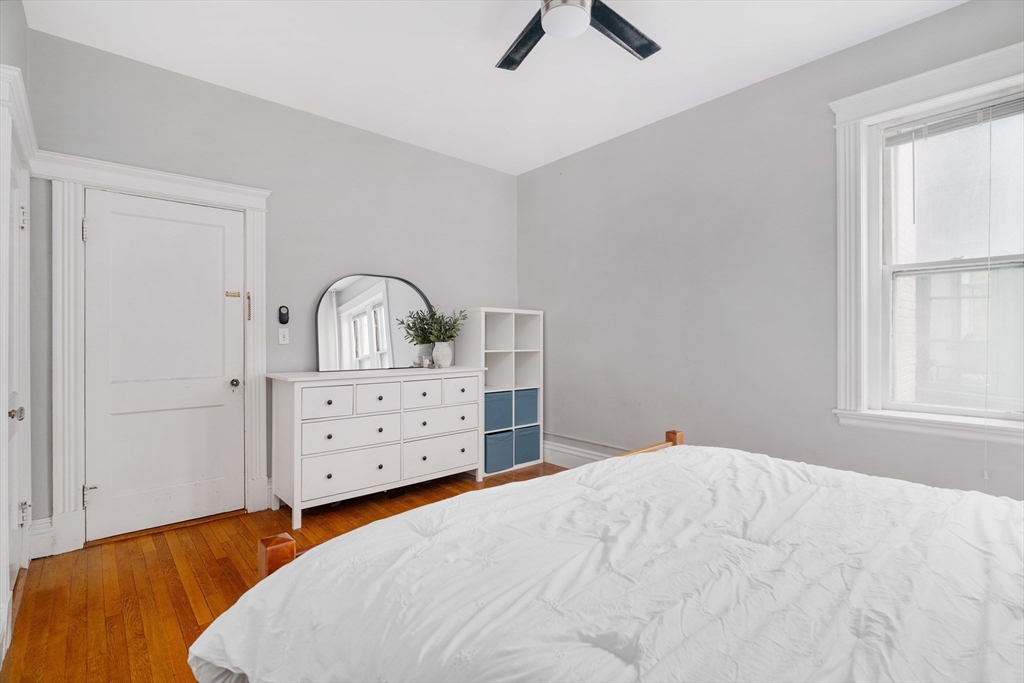 503 Boylston Street, Unit 4 Brookline, MA 02445 - Photo 9 of 16 a bedroom with a bed and a dresser