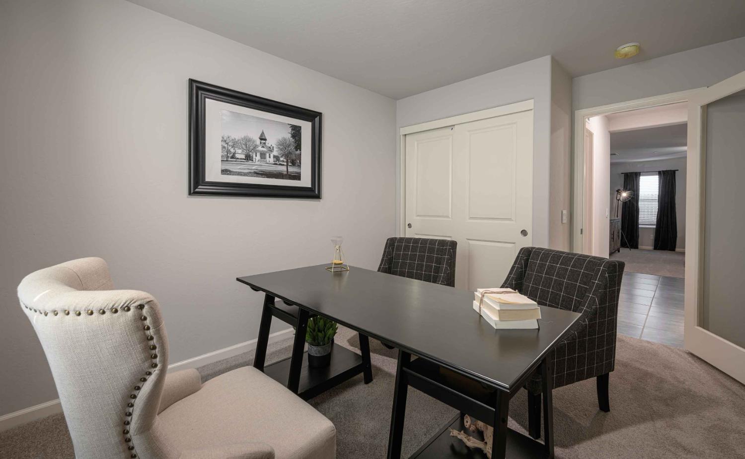 64 River Oak Court, Unit 47 Merced, CA 95341 - Photo 17 of 18 a view of a dining room with furniture and wooden floor