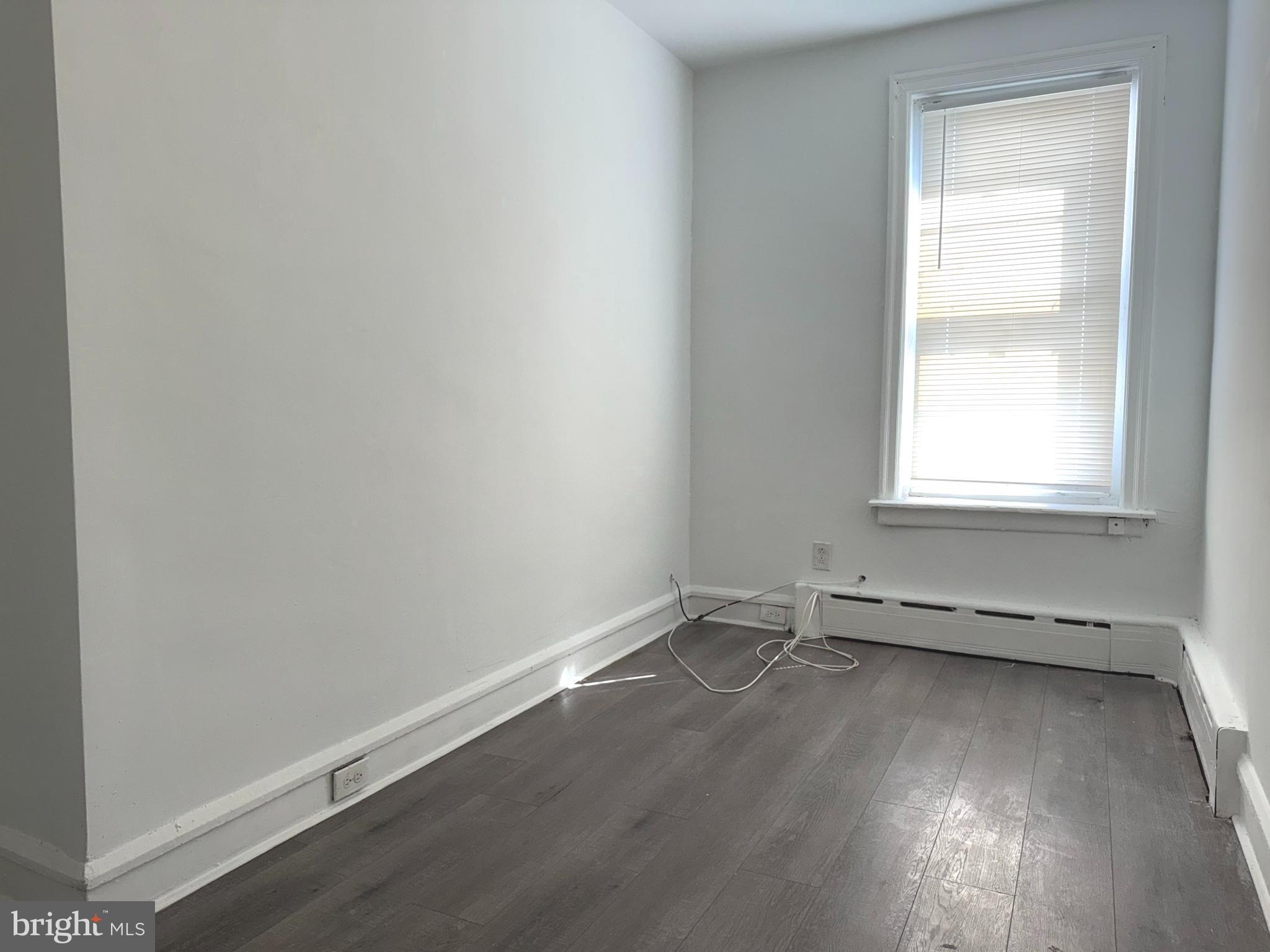 5756 Hunter Street Philadelphia, PA 19131 - Photo 11 of 16 an empty room with a window