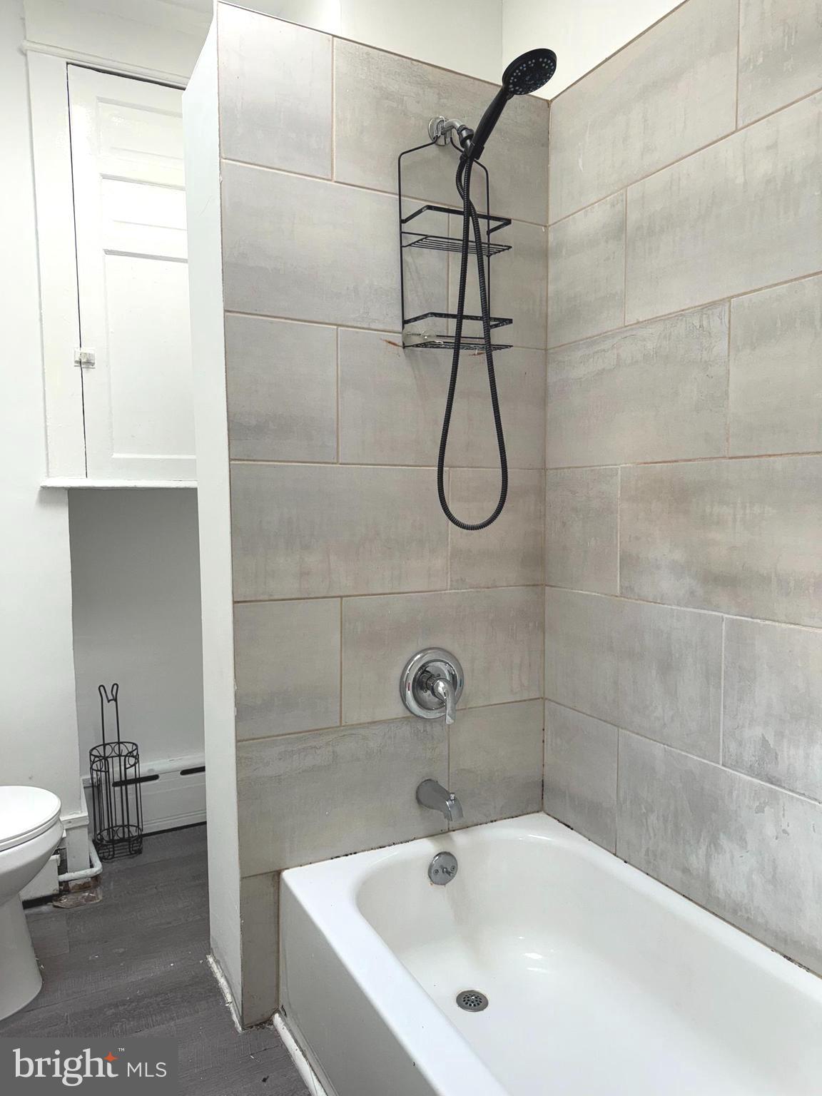 5756 Hunter Street Philadelphia, PA 19131 - Photo 12 of 16 a bathroom with a sink a toilet and shower