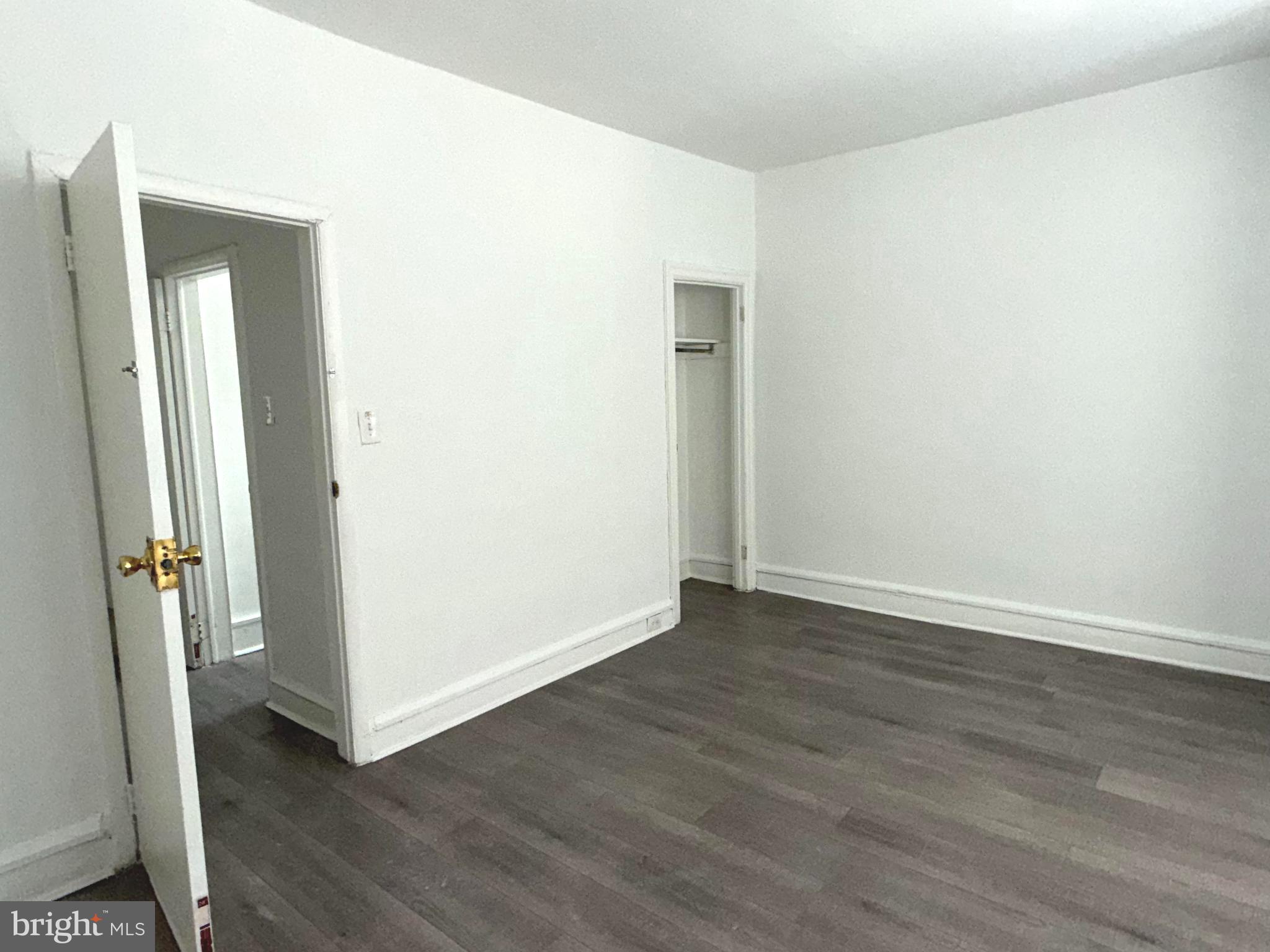 5756 Hunter Street Philadelphia, PA 19131 - Photo 15 of 16 an empty room with wooden floor and entrance