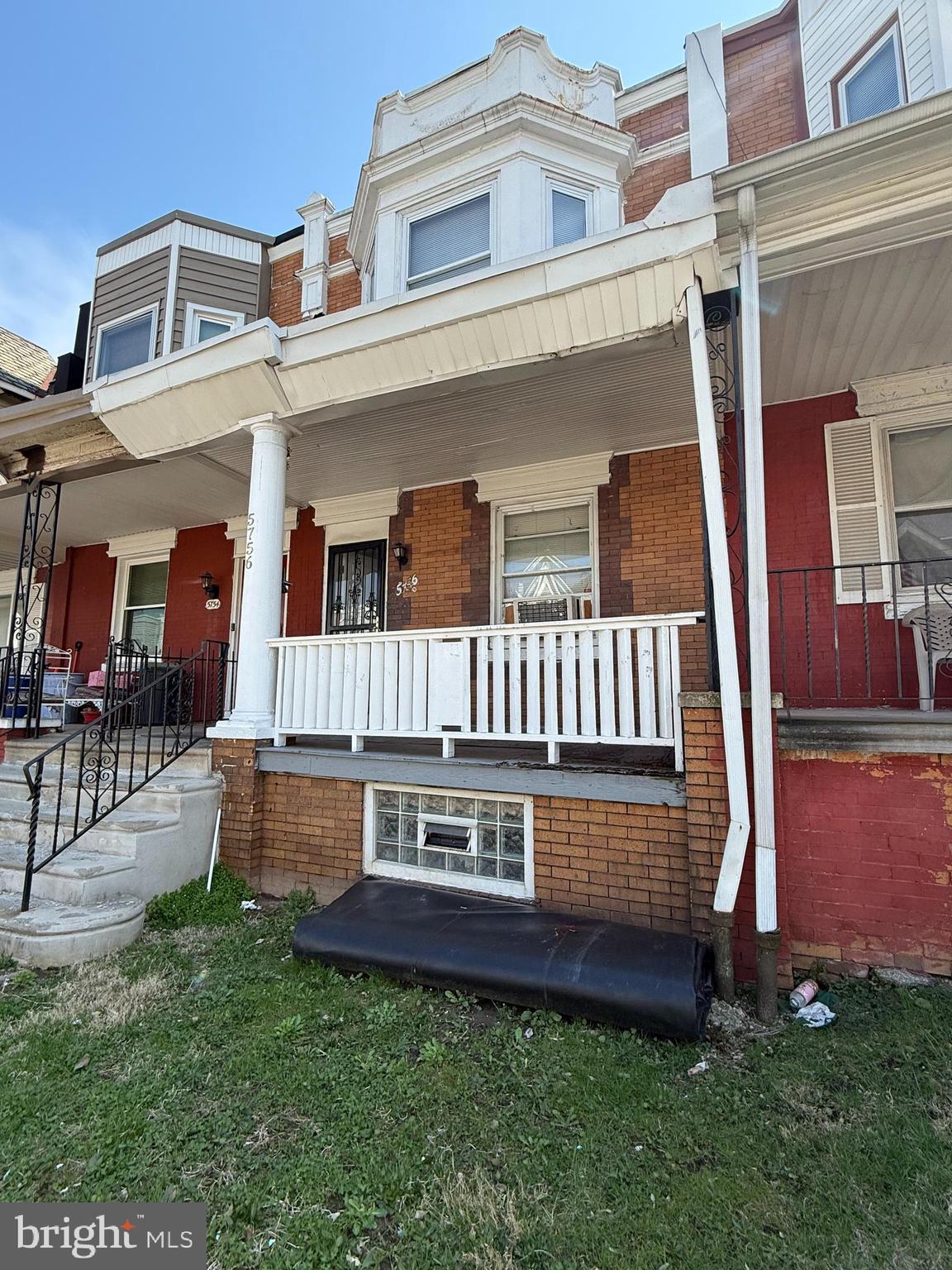5756 Hunter Street Philadelphia, PA 19131 - Photo 2 of 16 front view of a house with a yard